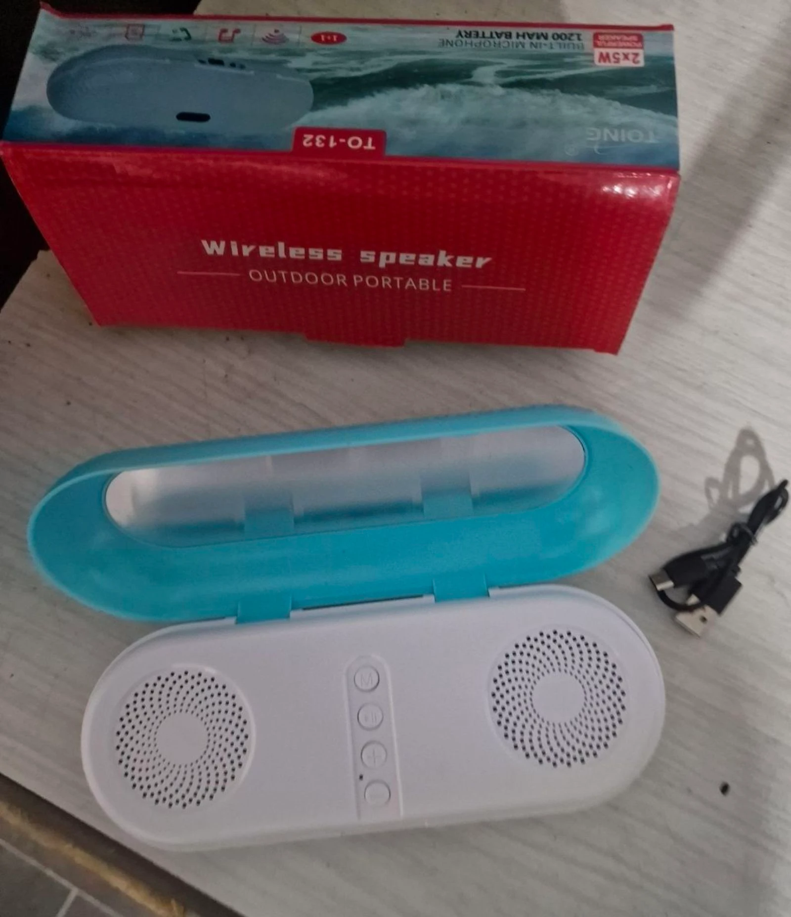 Altifalante Bluetooth portátil Toing TO-132, presentado en una caja azul claro. – photo 2